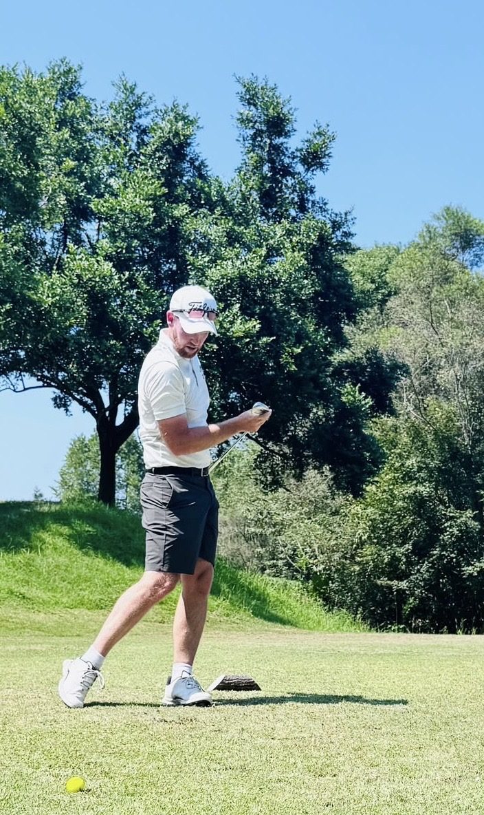 IGST member checking his club after a shot