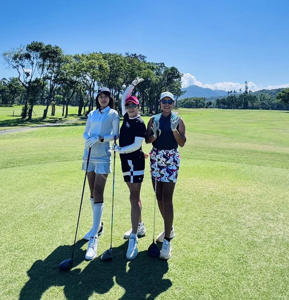 Three IGST lady golfers posing on a sunny fairway